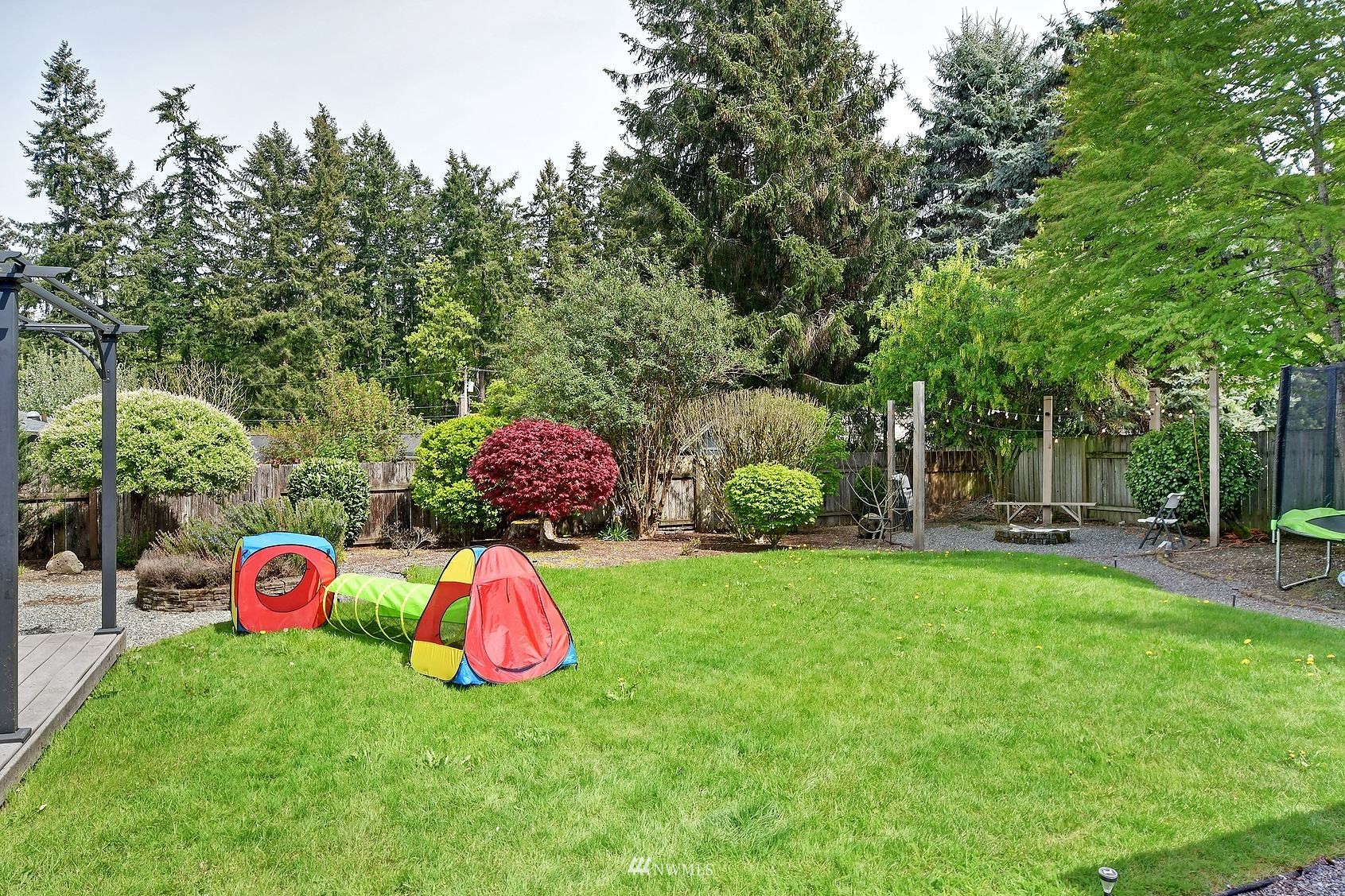 4515 Southeast 3rd Place Renton, WA 98059 - Photo 16 of 18 a backyard of a house with seating space