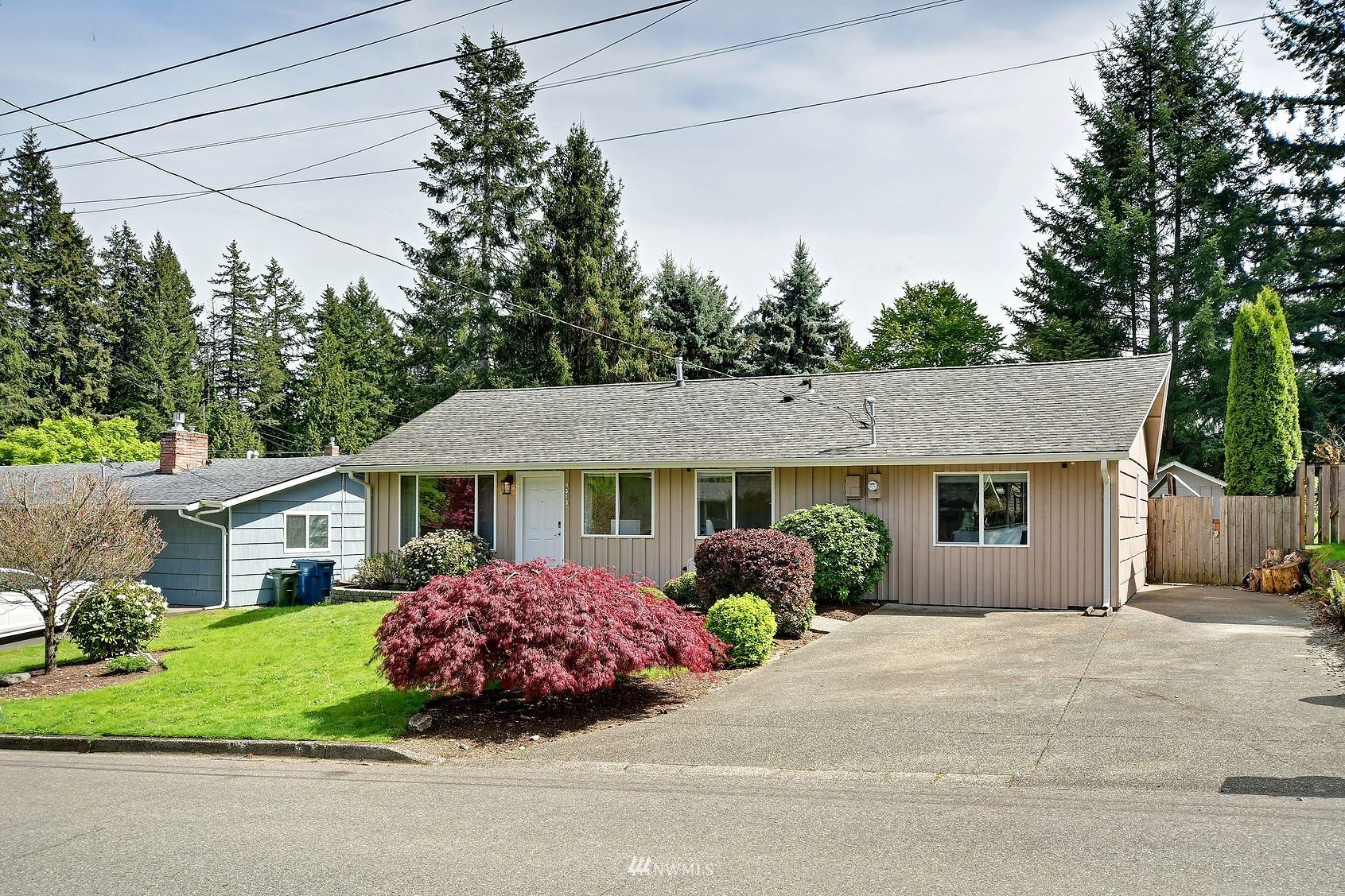 4515 Southeast 3rd Place Renton, WA 98059 - Photo 2 of 18 a front view of a house with a garden
