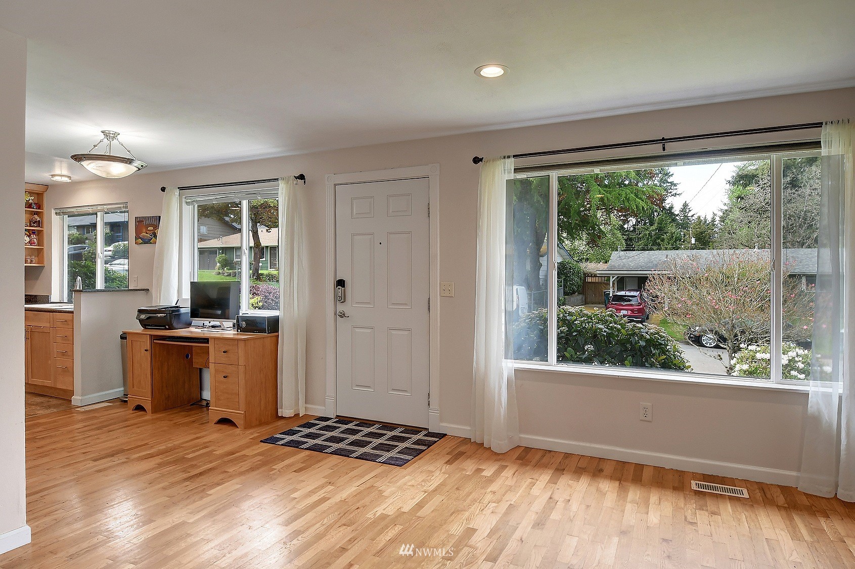 4515 Southeast 3rd Place Renton, WA 98059 - Photo 6 of 18 a view of a open kitchen with wooden floor and a window