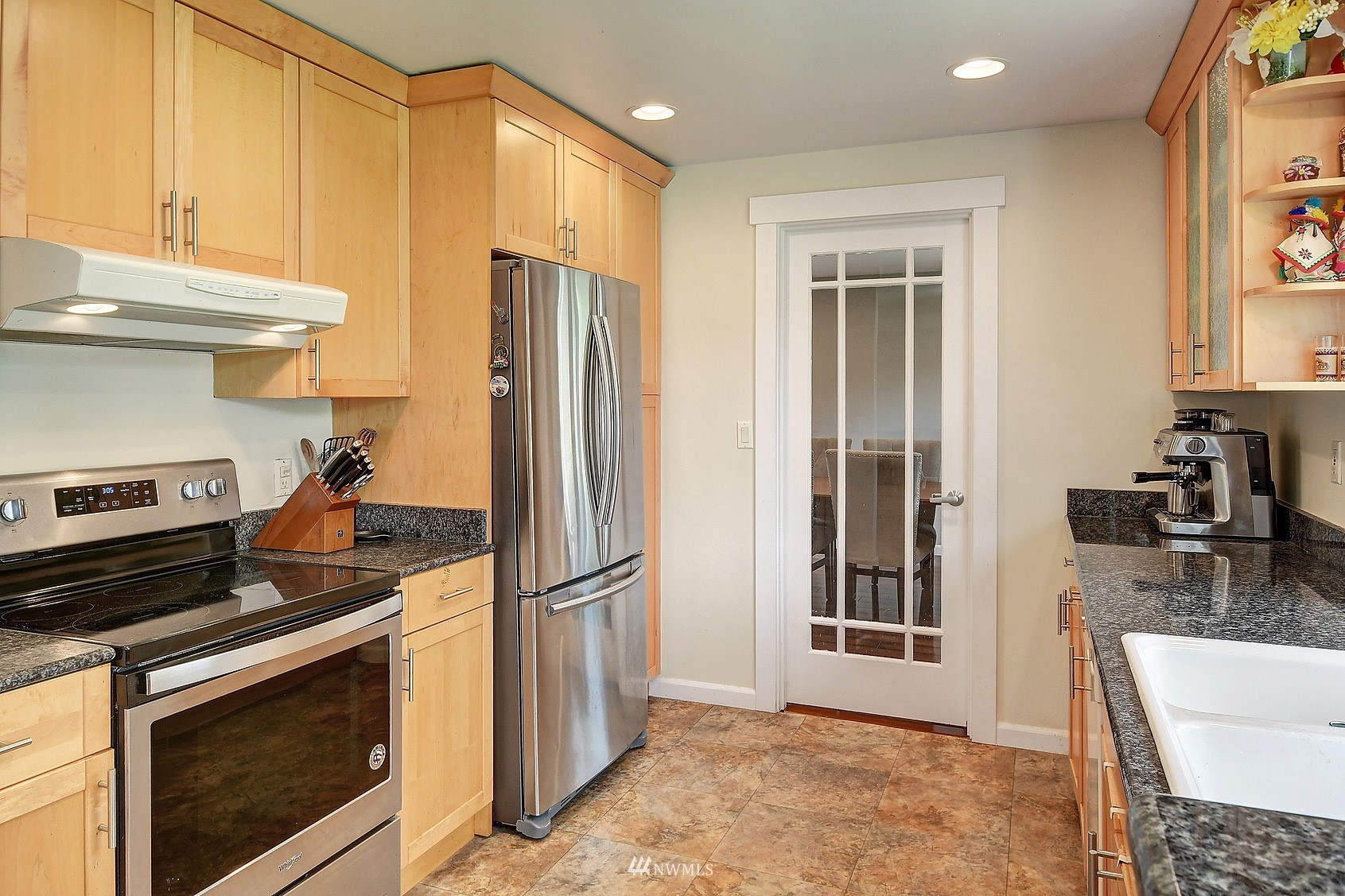 4515 Southeast 3rd Place Renton, WA 98059 - Photo 7 of 18 a kitchen with stainless steel appliances granite countertop a refrigerator stove and sink