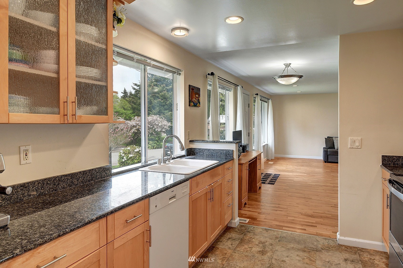 4515 Southeast 3rd Place Renton, WA 98059 - Photo 9 of 18 a large kitchen with kitchen island a large window in it and kitchen island