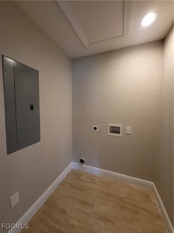 a view of a room with wooden floor