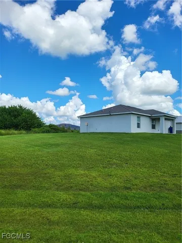 a view of a house with a big yard