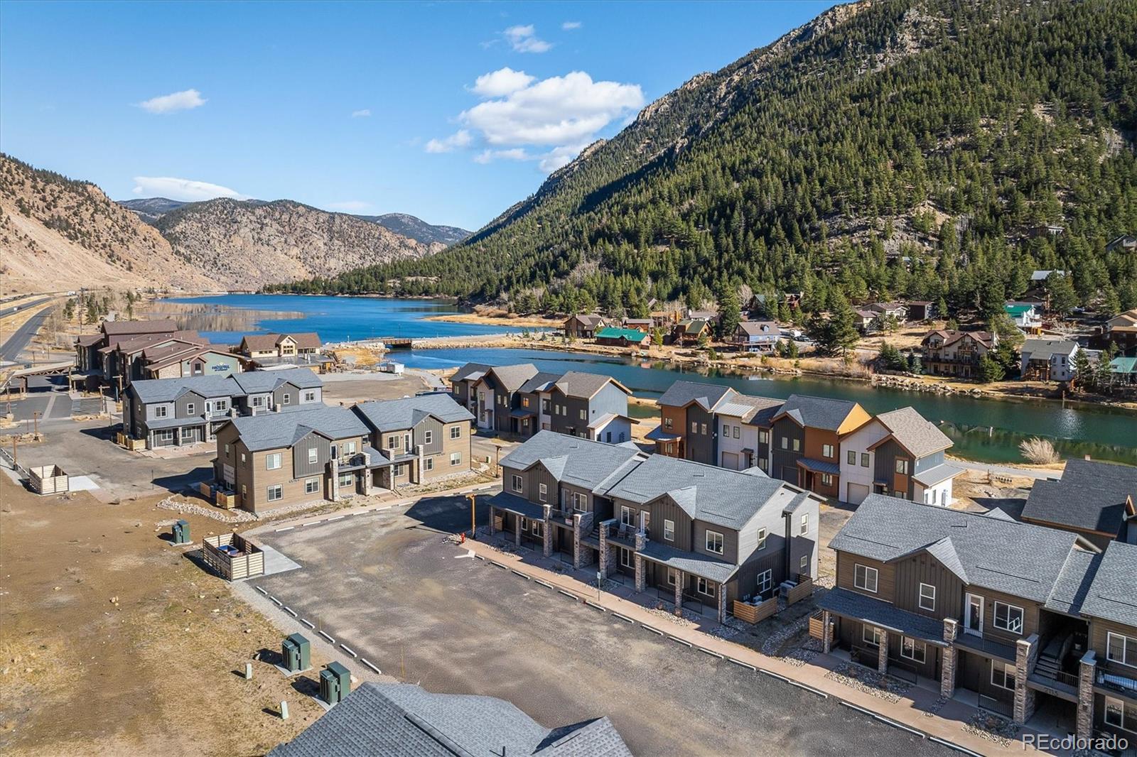 an aerial view of a house with swimming pool and ocean view