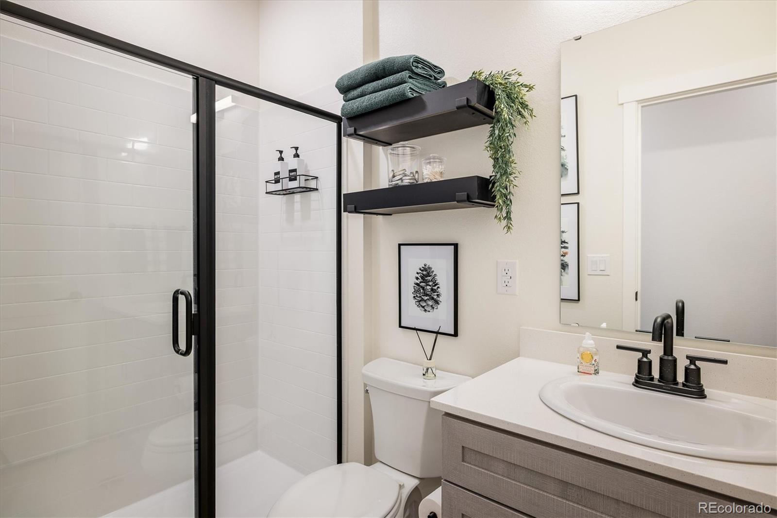 2121 Hummingbird Way, Unit 201 Georgetown, CO 80444 - Photo 13 of 29 a bathroom with a sink a toilet and shower