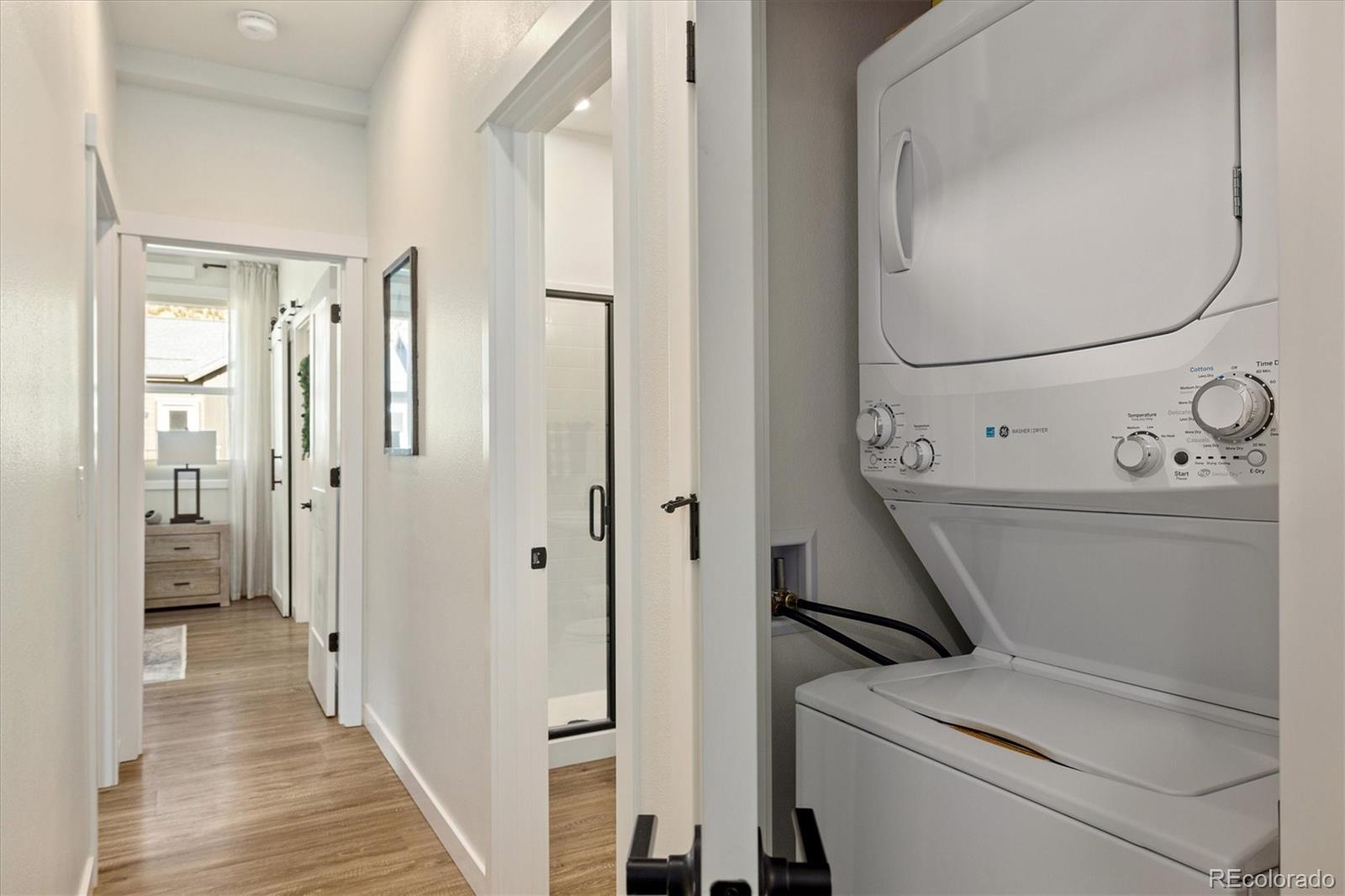 2121 Hummingbird Way, Unit 201 Georgetown, CO 80444 - Photo 14 of 29 a view of a hallway with washer and dryer