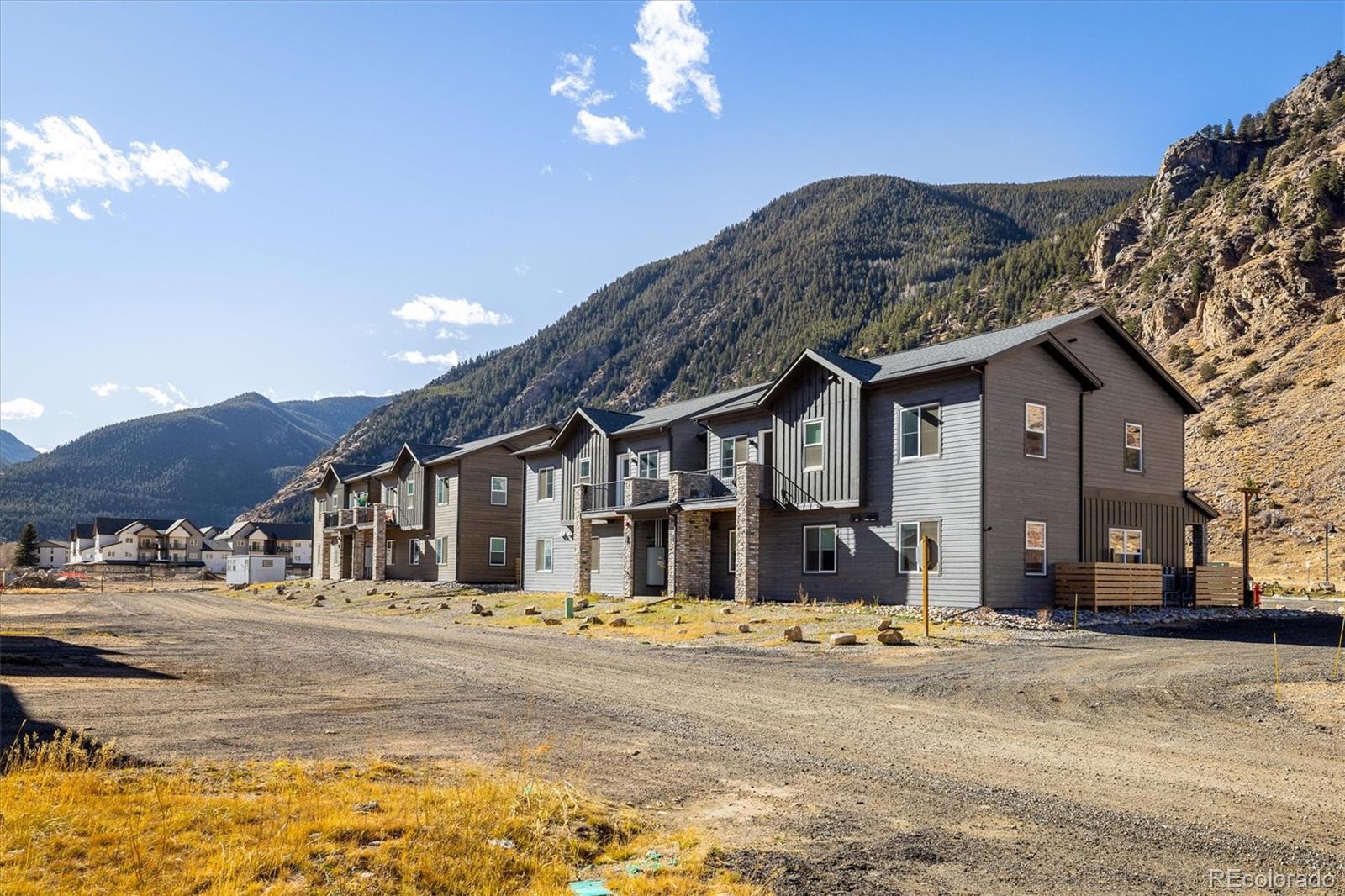 2121 Hummingbird Way, Unit 201 Georgetown, CO 80444 - Photo 18 of 29 a front view of a house with a yard