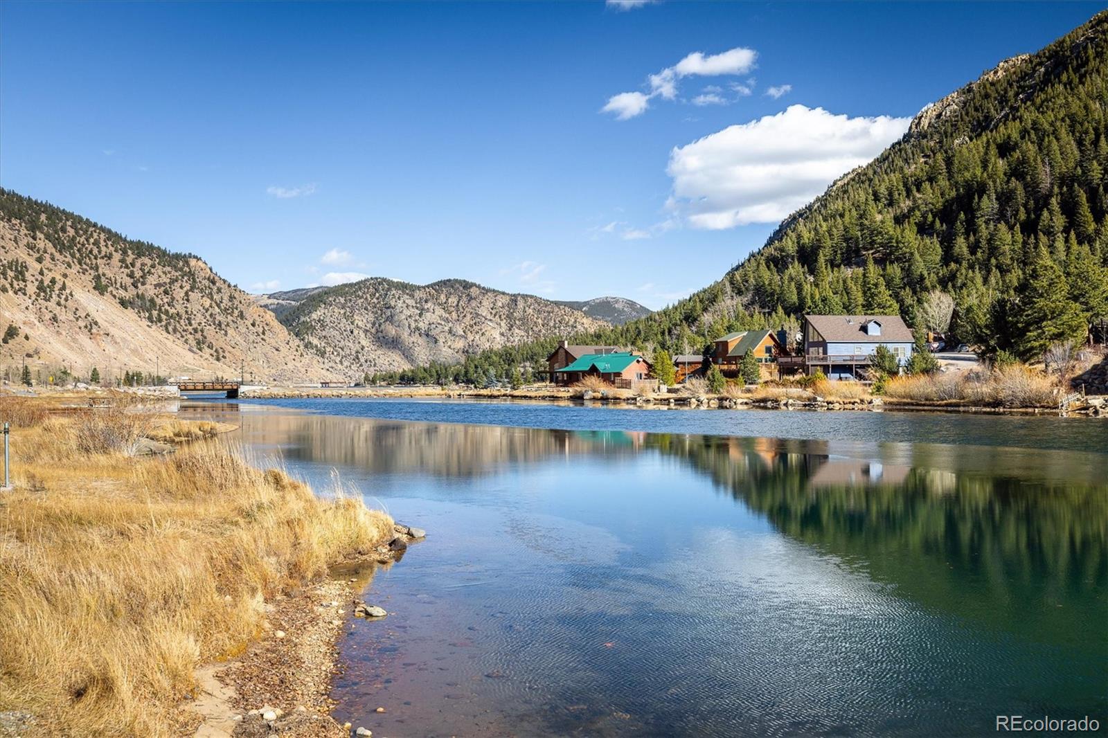 2121 Hummingbird Way, Unit 201 Georgetown, CO 80444 - Photo 24 of 29 a view of a lake with a mountain