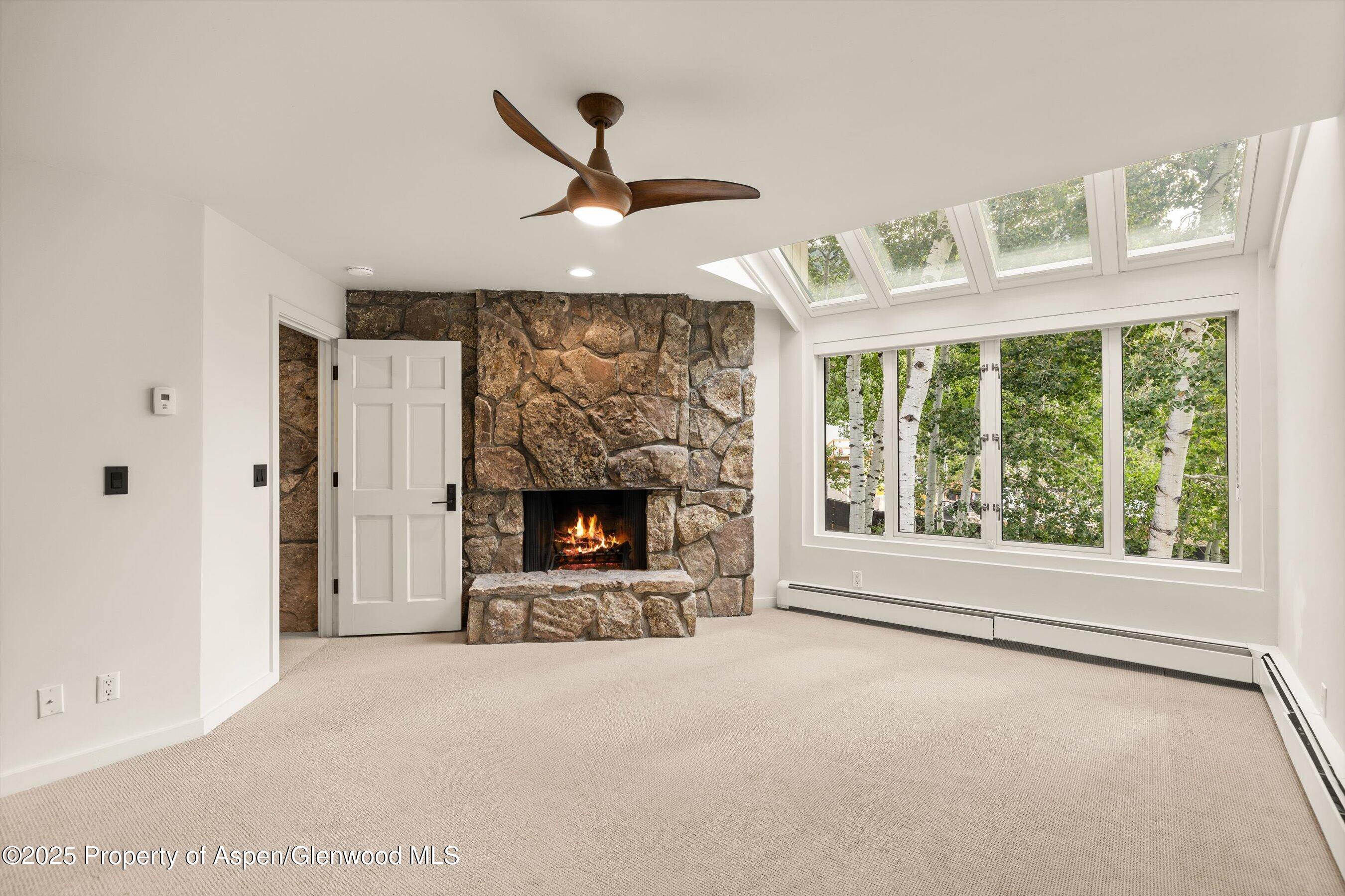 1443 Crystal Lake Road, Unit 3E Aspen, CO 81611 - Photo 14 of 34 a living room with furniture and a fireplace