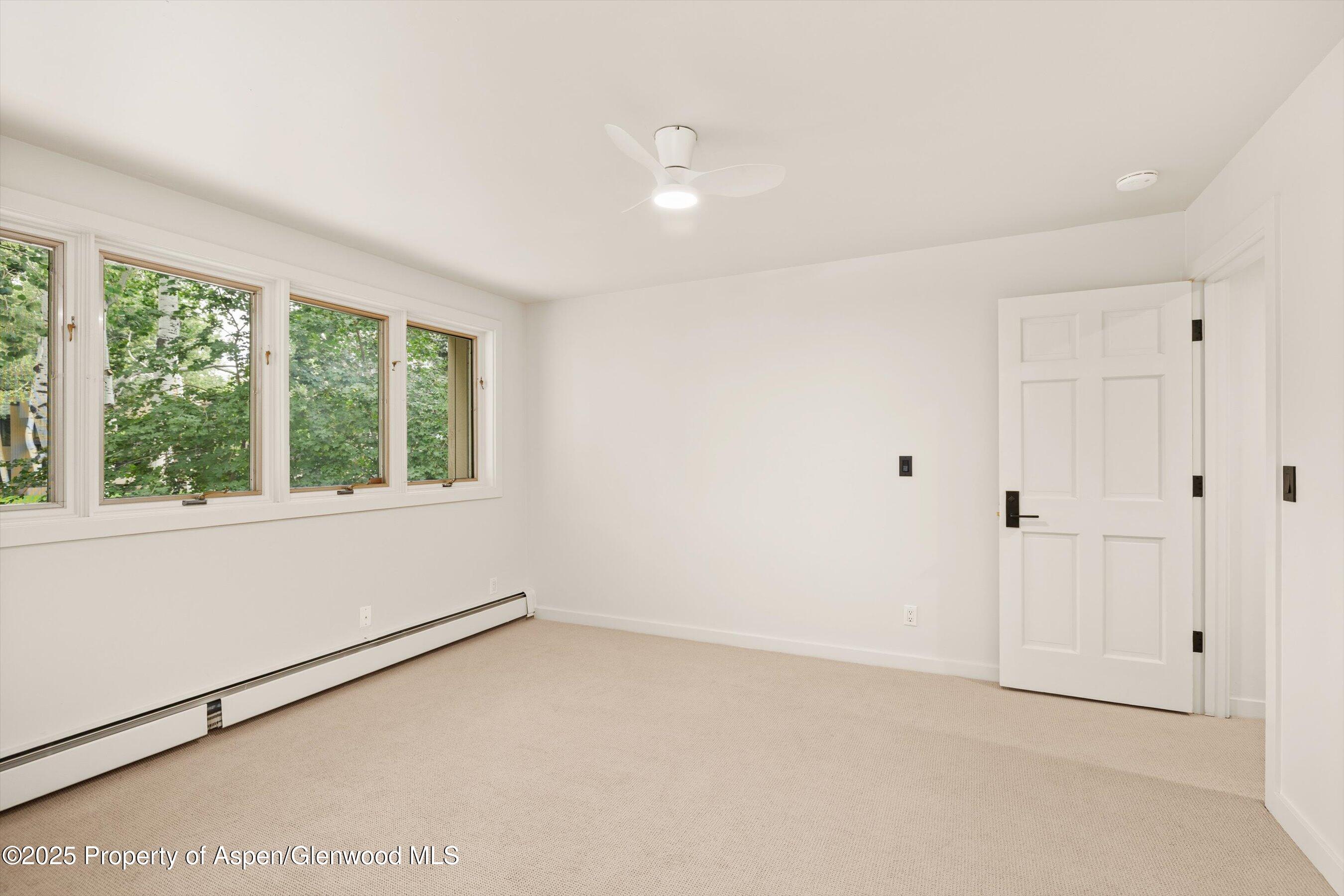 1443 Crystal Lake Road, Unit 3E Aspen, CO 81611 - Photo 21 of 34 a view of an empty room with a window