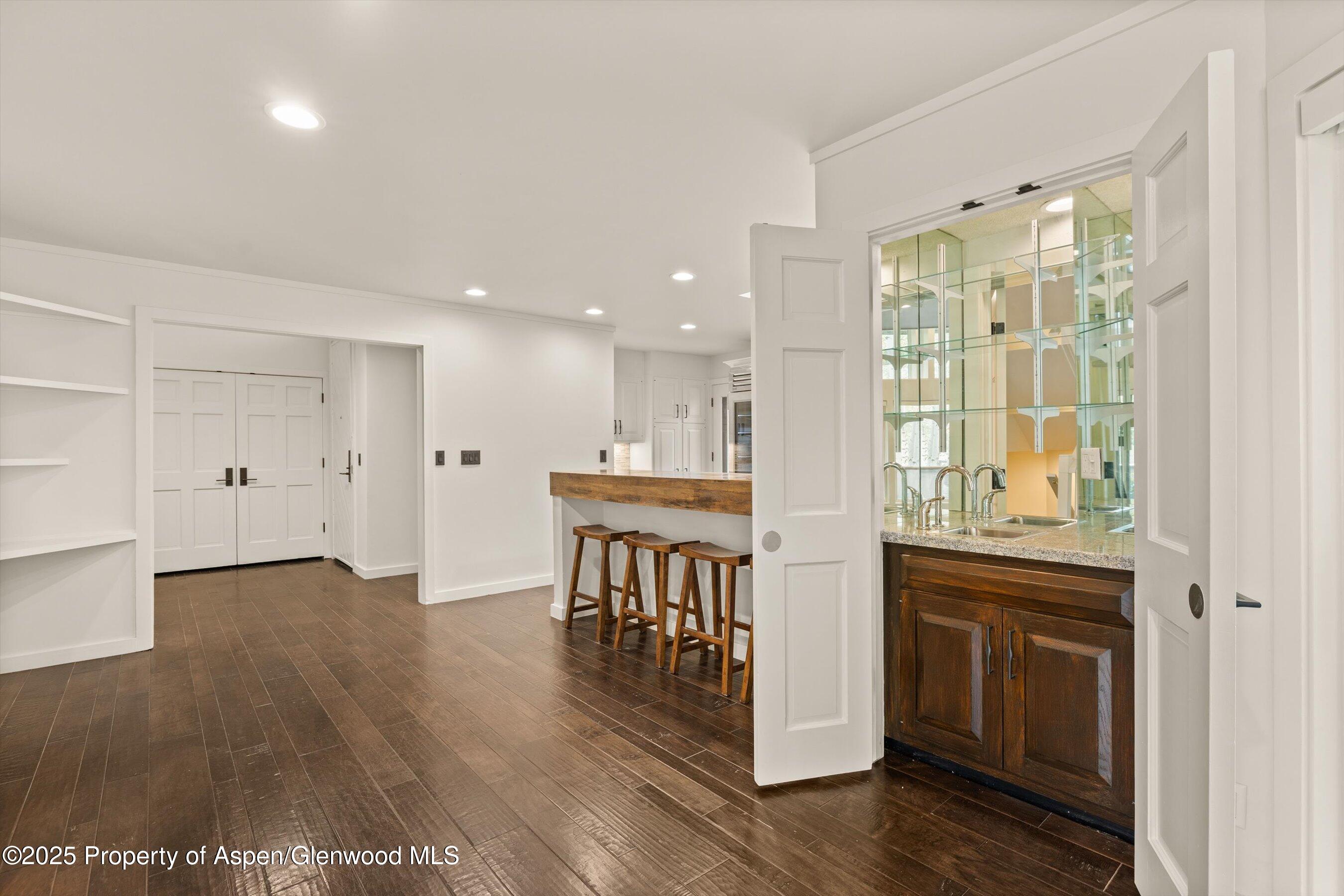 1443 Crystal Lake Road, Unit 3E Aspen, CO 81611 - Photo 5 of 34 a view of a kitchen with furniture and wooden floor
