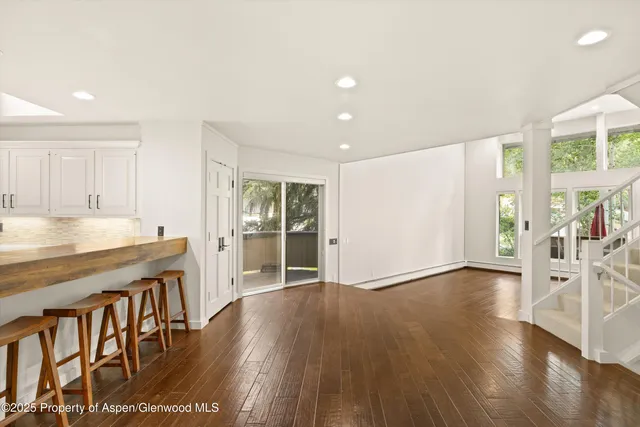 a kitchen with a stove a refrigerator and a sink