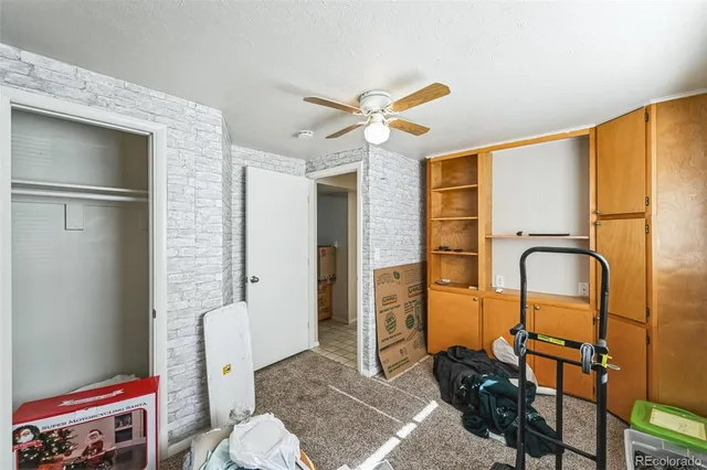 a spacious bathroom with a granite countertop sink a mirror and shower