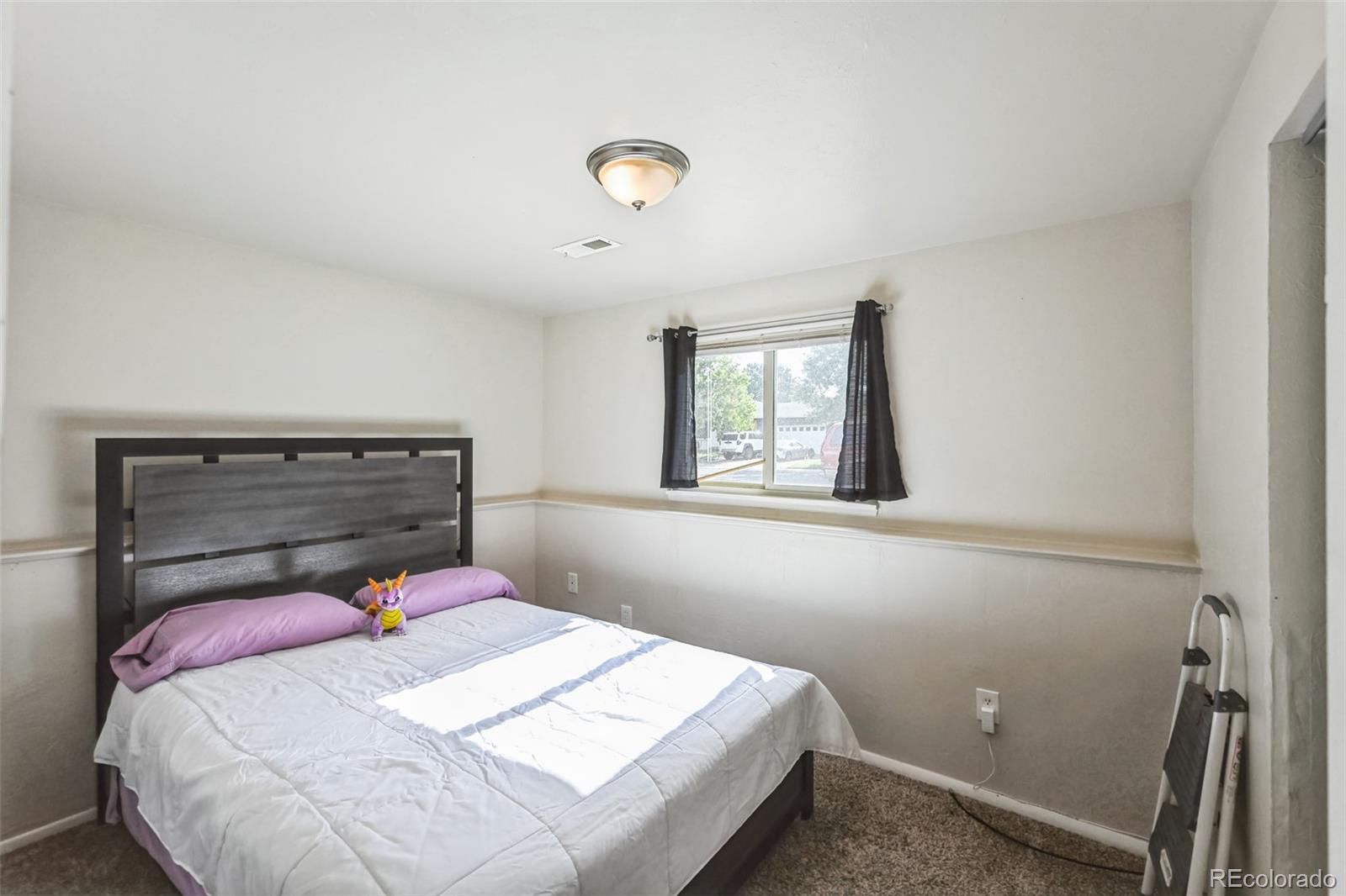 15640 East Eldorado Drive Aurora, CO 80013 - Photo 18 of 33 a bedroom with a bed and a window