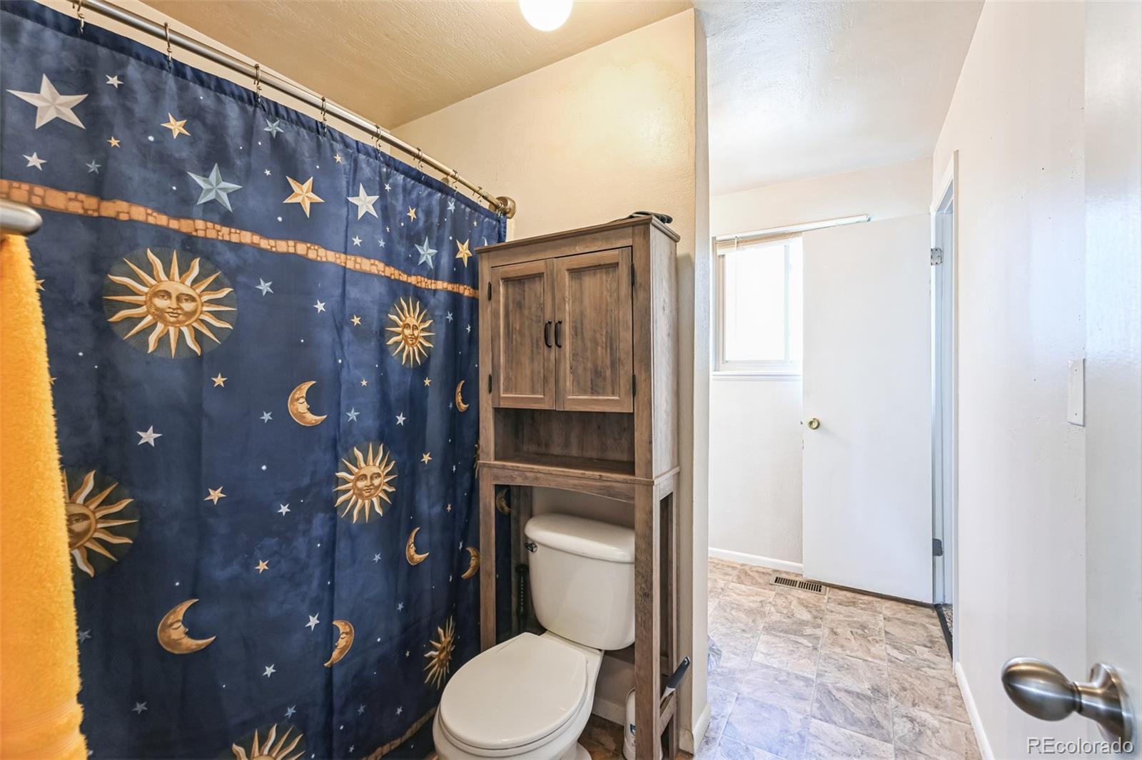 15640 East Eldorado Drive Aurora, CO 80013 - Photo 21 of 33 a bathroom with a toilet and a shower