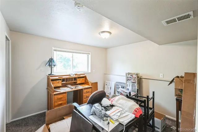 a workspace with furniture and a window