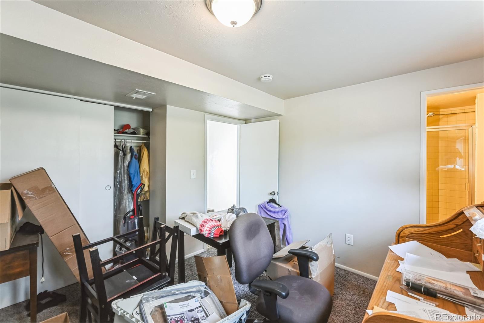 15640 East Eldorado Drive Aurora, CO 80013 - Photo 25 of 33 a living room with furniture and a window