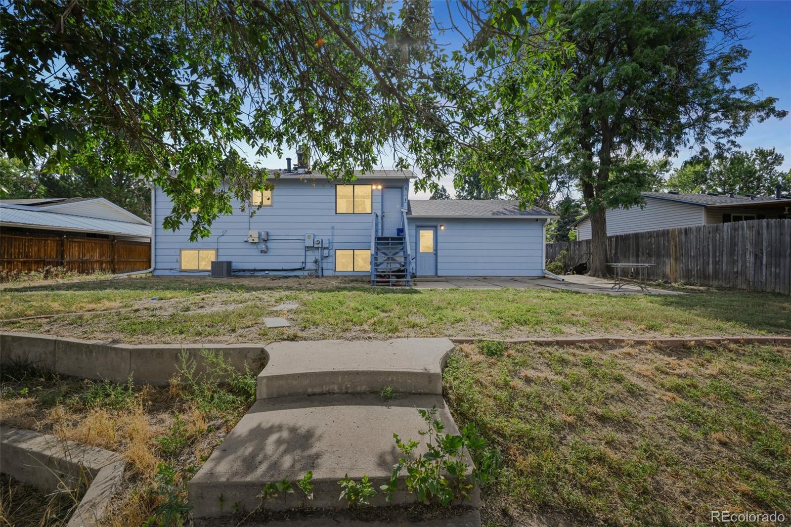 15640 East Eldorado Drive Aurora, CO 80013 - Photo 28 of 33 a view of a house with a yard