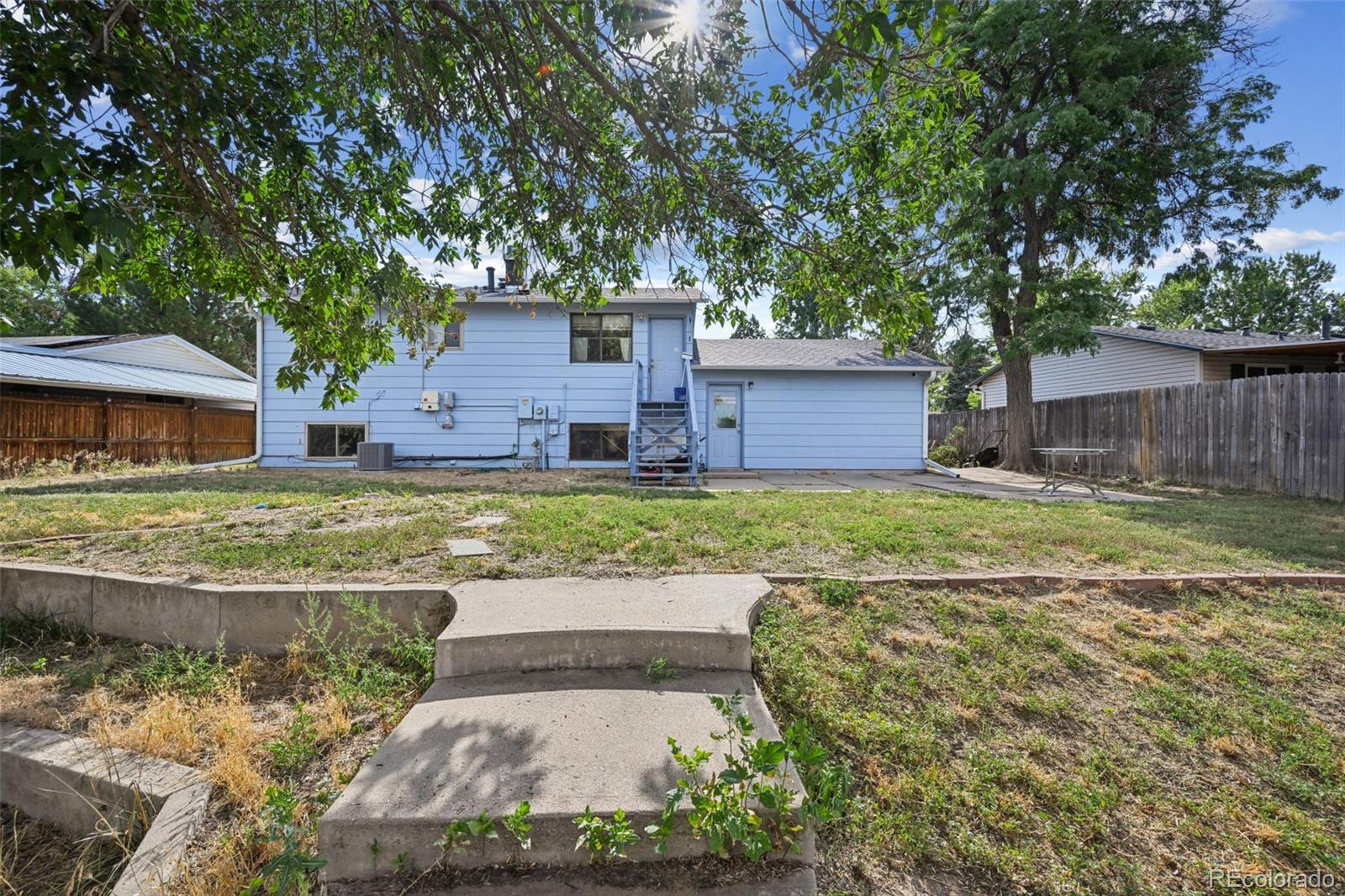 15640 East Eldorado Drive Aurora, CO 80013 - Photo 30 of 33 a view of a house with a yard