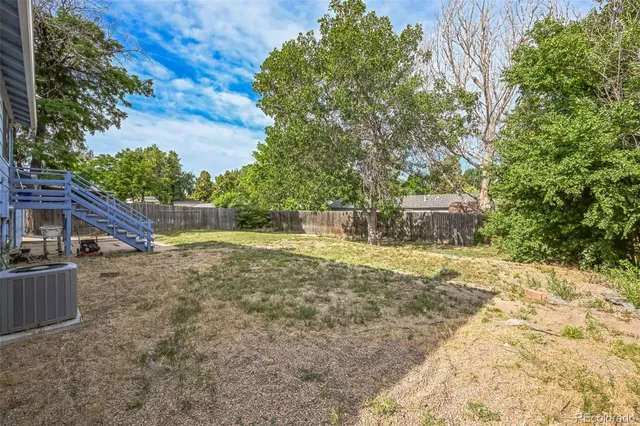 a view of backyard with outdoor and entertaining space