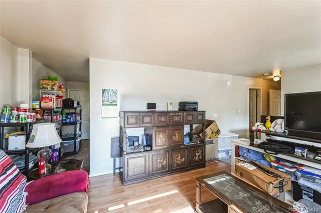 a room with furniture and a flat screen tv