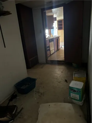 a view of a livingroom with furniture and staircase