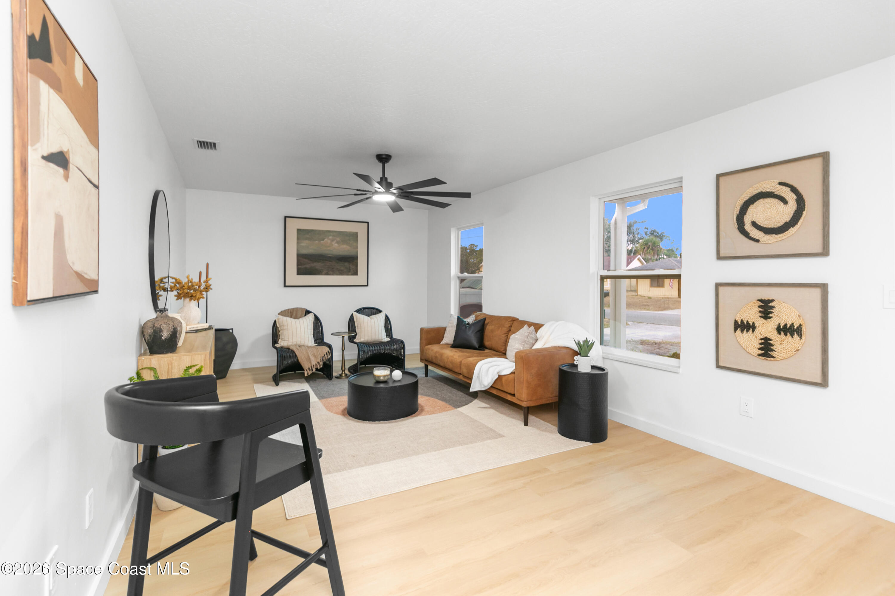 5095 Hogan Place Cocoa, FL 32927 - Photo 6 of 23 a living room with furniture and wooden floor