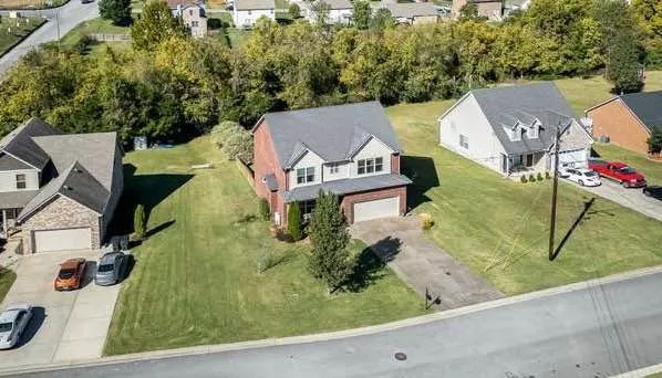 an aerial view of a house with swimming pool