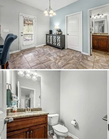 a en suite bathroom with a granite countertop sink a toilet and a mirror