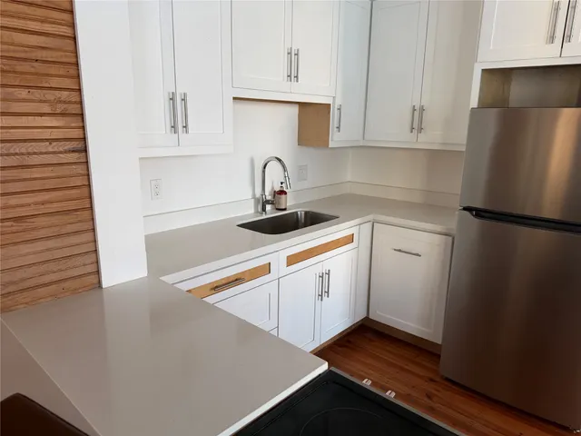 a kitchen with a sink and cabinets