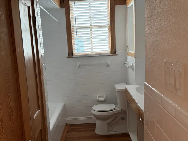 a bathroom with a toilet a sink and a bathtub