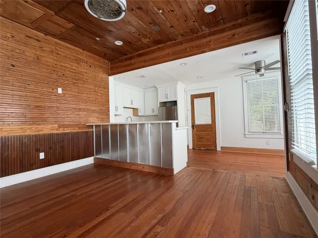 a view of a livingroom with wooden floor