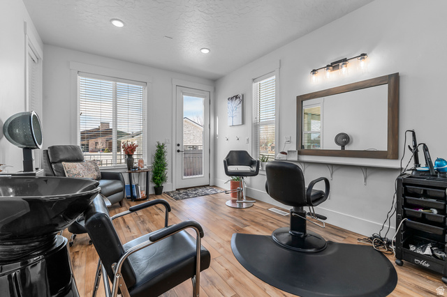 1426 South 1450th Street West Mapleton, UT 84664 - Photo 35 of 50 Spacious interior with wood-finish flooring, recessed lighting, and ample natural light from multiple windows and a glass-paneled door