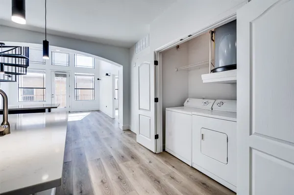a view of kitchen with furniture and wooden floor