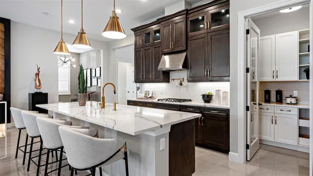 a kitchen with a sink cabinets and window
