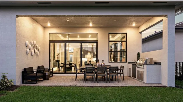 a view of a chairs and table in a patio