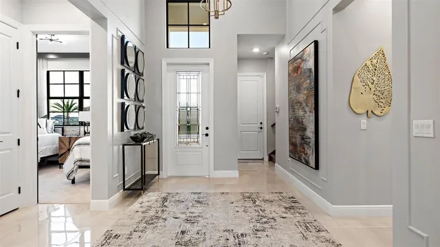 a view of a hallway with windows and closet