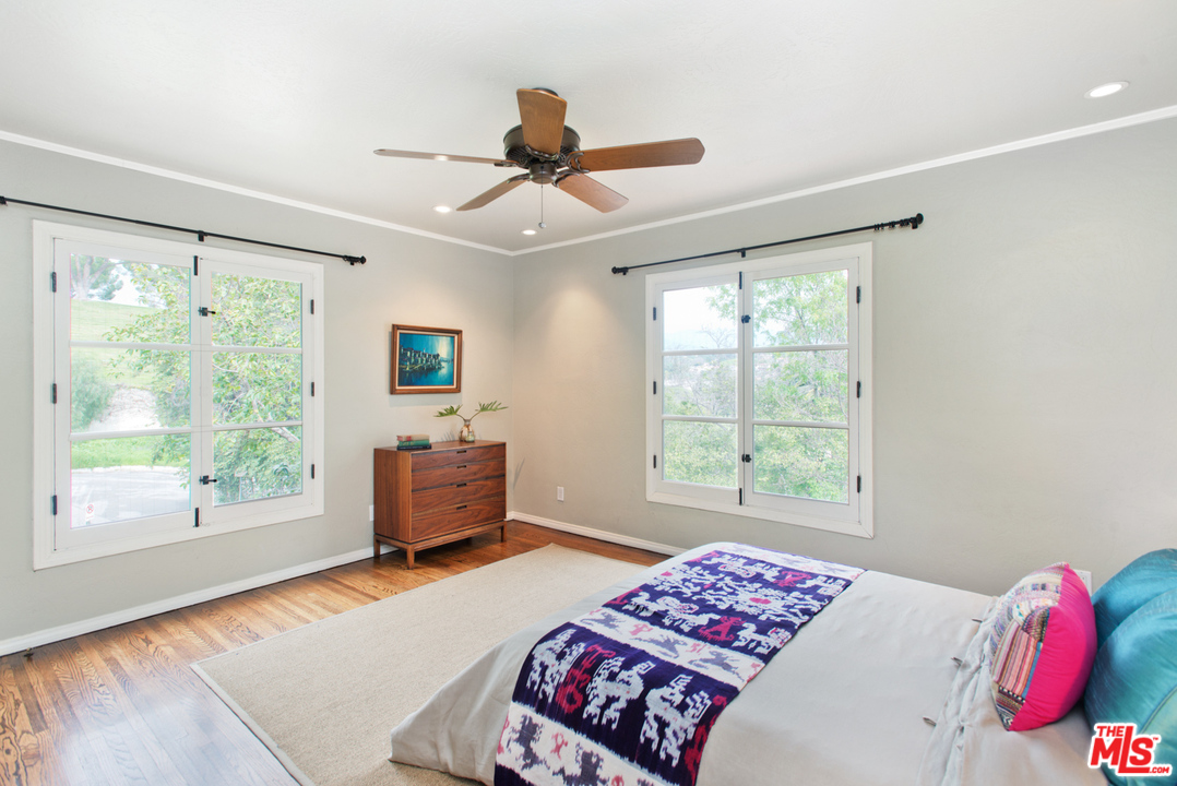 3937 Roderick Road Los Angeles, CA 90065 - Photo 15 of 28 a bedroom with a bed and a large window