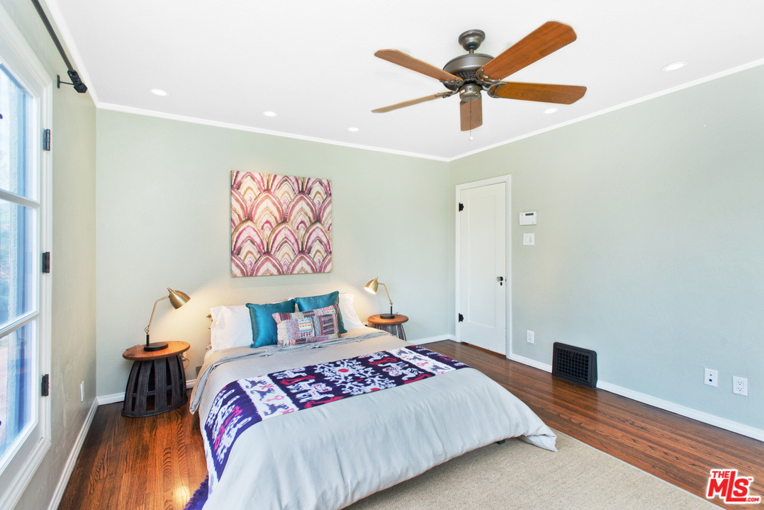 3937 Roderick Road Los Angeles, CA 90065 - Photo 16 of 28 a bedroom with a bed and a painting on the wall