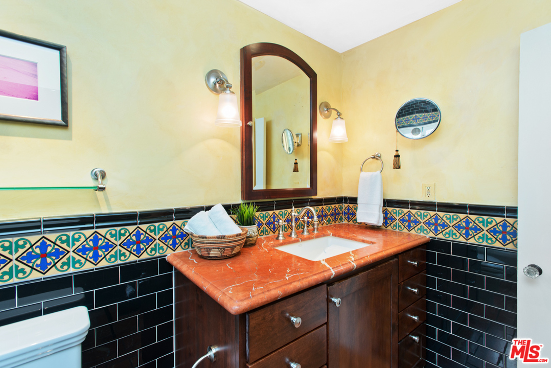 3937 Roderick Road Los Angeles, CA 90065 - Photo 19 of 28 a bathroom with a sink and a mirror