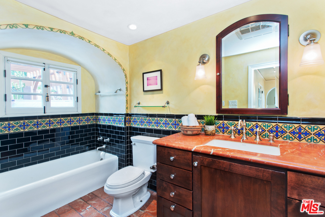 3937 Roderick Road Los Angeles, CA 90065 - Photo 20 of 28 a bathroom with a sink a toilet and a bathtub