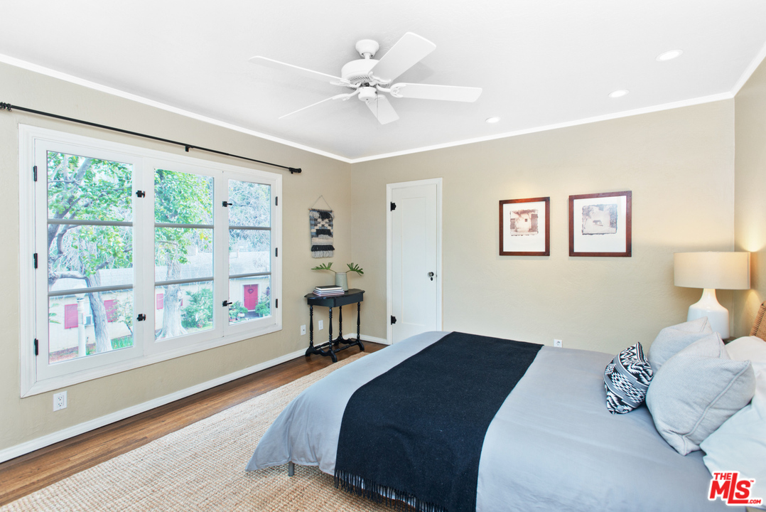 3937 Roderick Road Los Angeles, CA 90065 - Photo 21 of 28 a bedroom with a bed and a large window