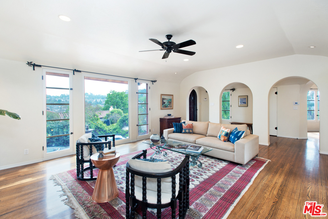 3937 Roderick Road Los Angeles, CA 90065 - Photo 7 of 28 a living room with furniture a table and a large window