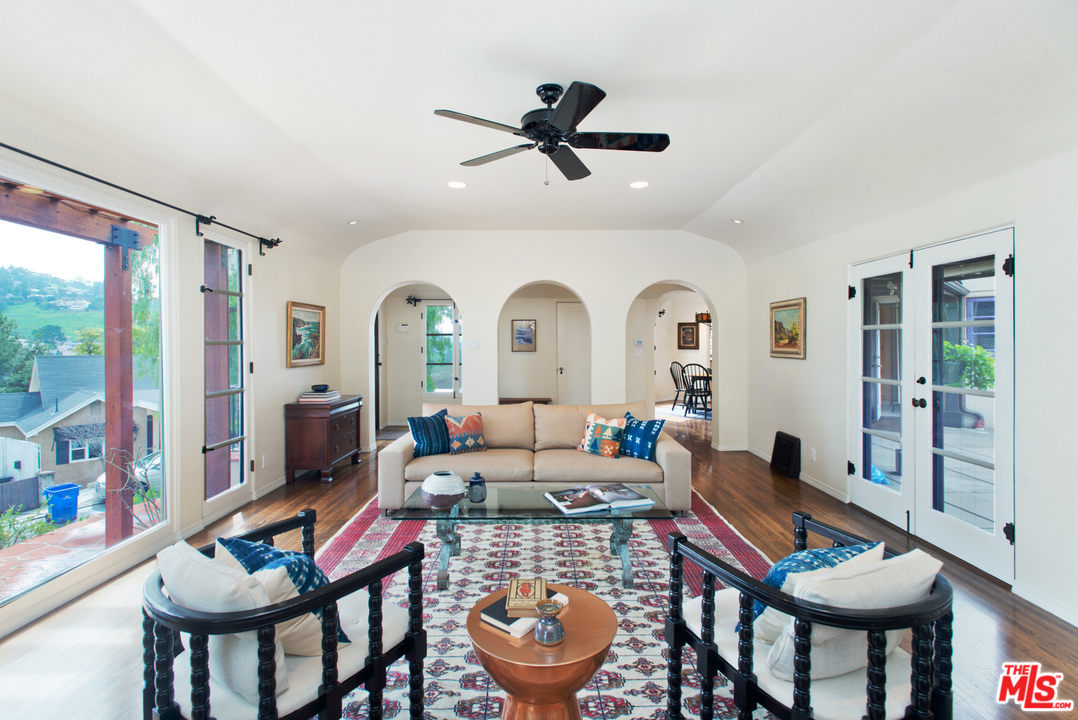 3937 Roderick Road Los Angeles, CA 90065 - Photo 8 of 28 a living room with furniture a large window and a rug
