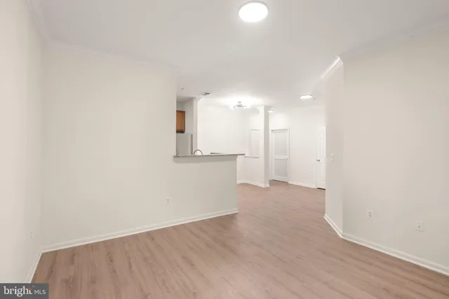 a bedroom with a large bed and a large window