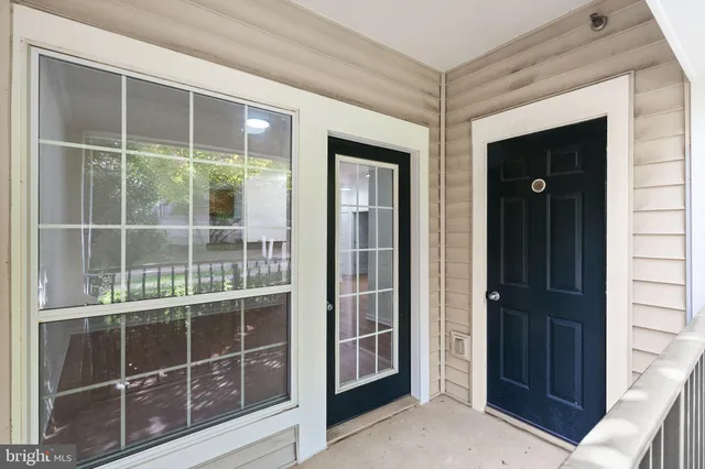 a view of an empty room and wooden floor