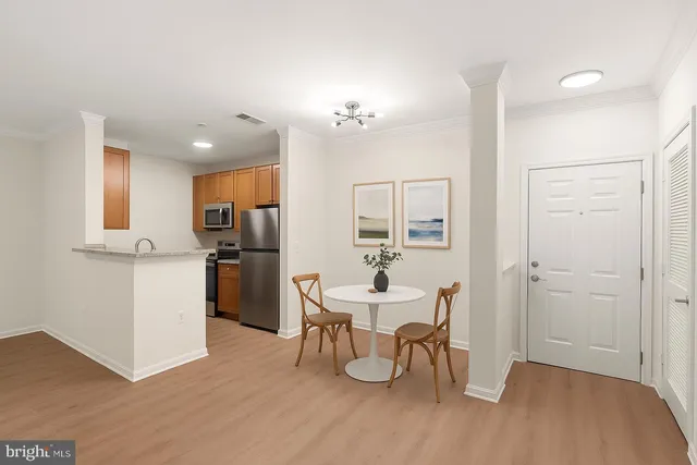 a view of kitchen with wooden floor