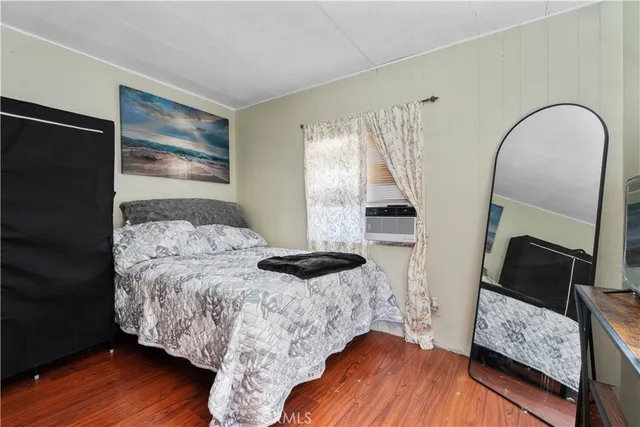 a bed room with a bed and a window