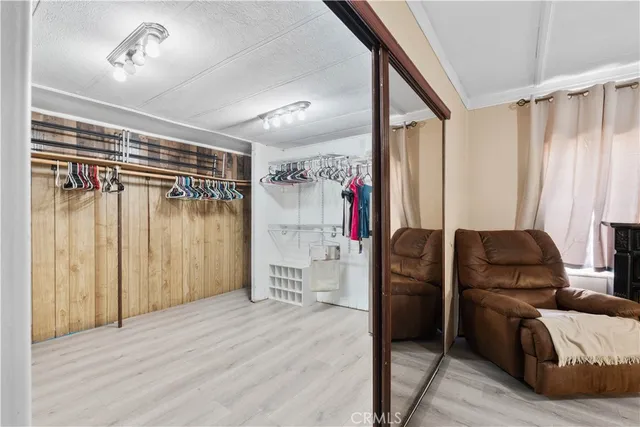 a view of a bathroom with a tub shower and mirror