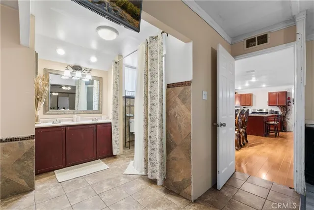 a bathroom with a sink toilet a mirror and shower